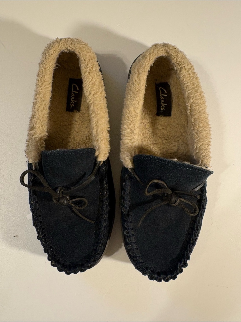 Clarks Black Suede Moccasin Slippers with Cream Shearling Lining